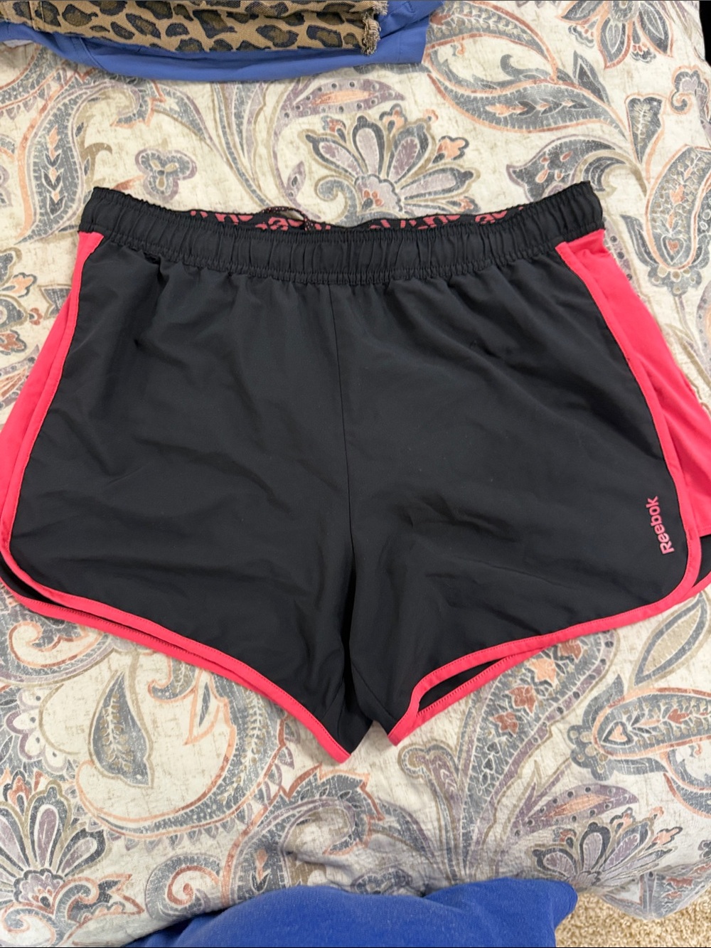 Reebok women’s Play Dri Black Athletic Shorts with Pink Trim